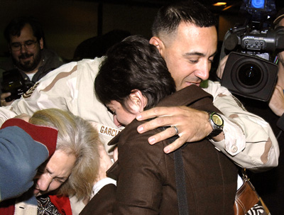 Tech Sgt. Frank Garcia is greeted by his mother
